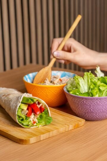 fresh vegetable wrap with vibrant salad bowls