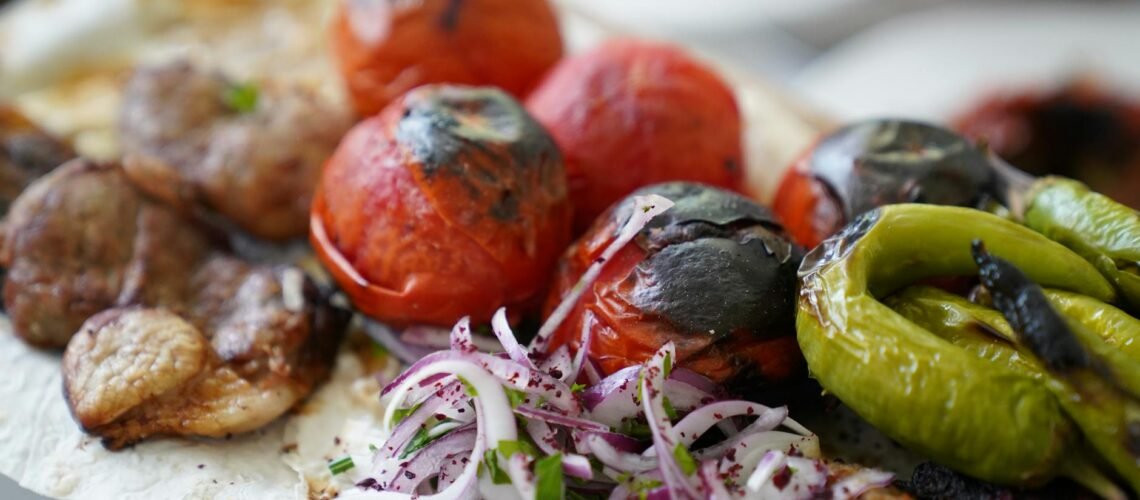 grilled vegetables and meat platter close up